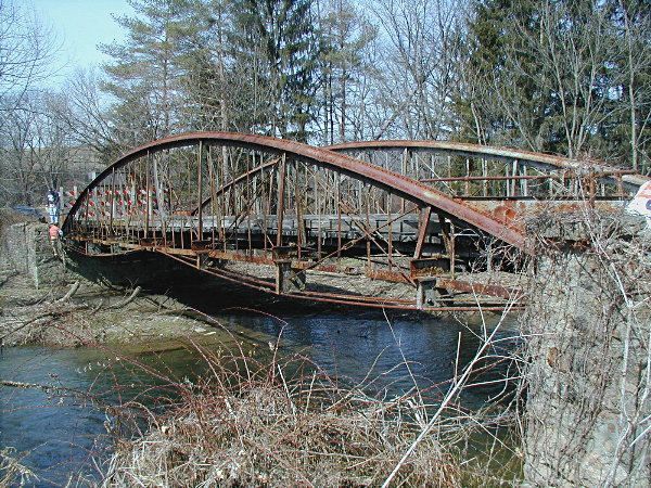 Henszey's Bridge was listed in the National Register for its engineering as a rare surviving example of a 19th century bowstring arch bridge. Source: Lawrence Biemiller.