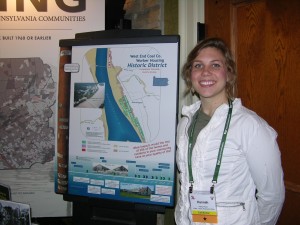 Spring 2015 T.H.I.S. Intern Hannah Keck proudly displaying her poster on the impacts of repetitive flooding on Luzerne County’s village of Mocanaqua and its West End Coal Company Worker Housing Historic District.