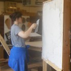 Apprentice Amanda Asmus tries her hand at applying the finish coat during the apprentice training workshop (PHMC staff)