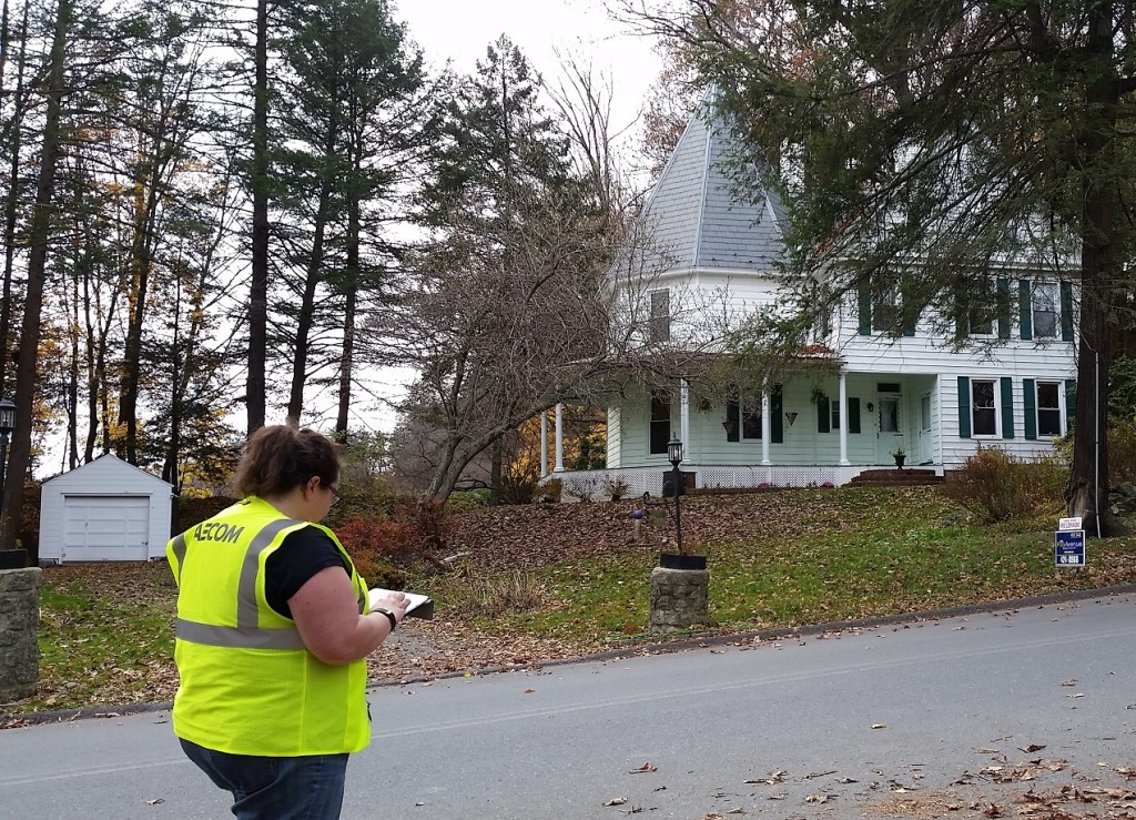 AECOM team member Jennifer Robinson records data on an Android tablet for the circa 1862 Reynolds House in Hamilton Twp.