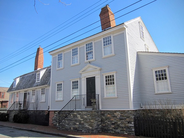 This 18th century residence on Bridge Street in Newport, Rhode Island’s historic Point Neighborhood was a source of controversy and a catalyst for the April 2016 Keeping History Above Water conference when it was elevated by the current owners to better protect it from recurring coastal flooding. At left is the historic residence in 2012, situated at grade; at right is the residence in 2016, perched upon a 4’9”-high stone foundation above the base flood elevation (100-year flood level).