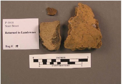 Smoothed exterior and shell-tempered ceramic sherds of Edinburg Phase Mahoning Ware recovered from the Ashton Cemetery Site (36LR0165).
