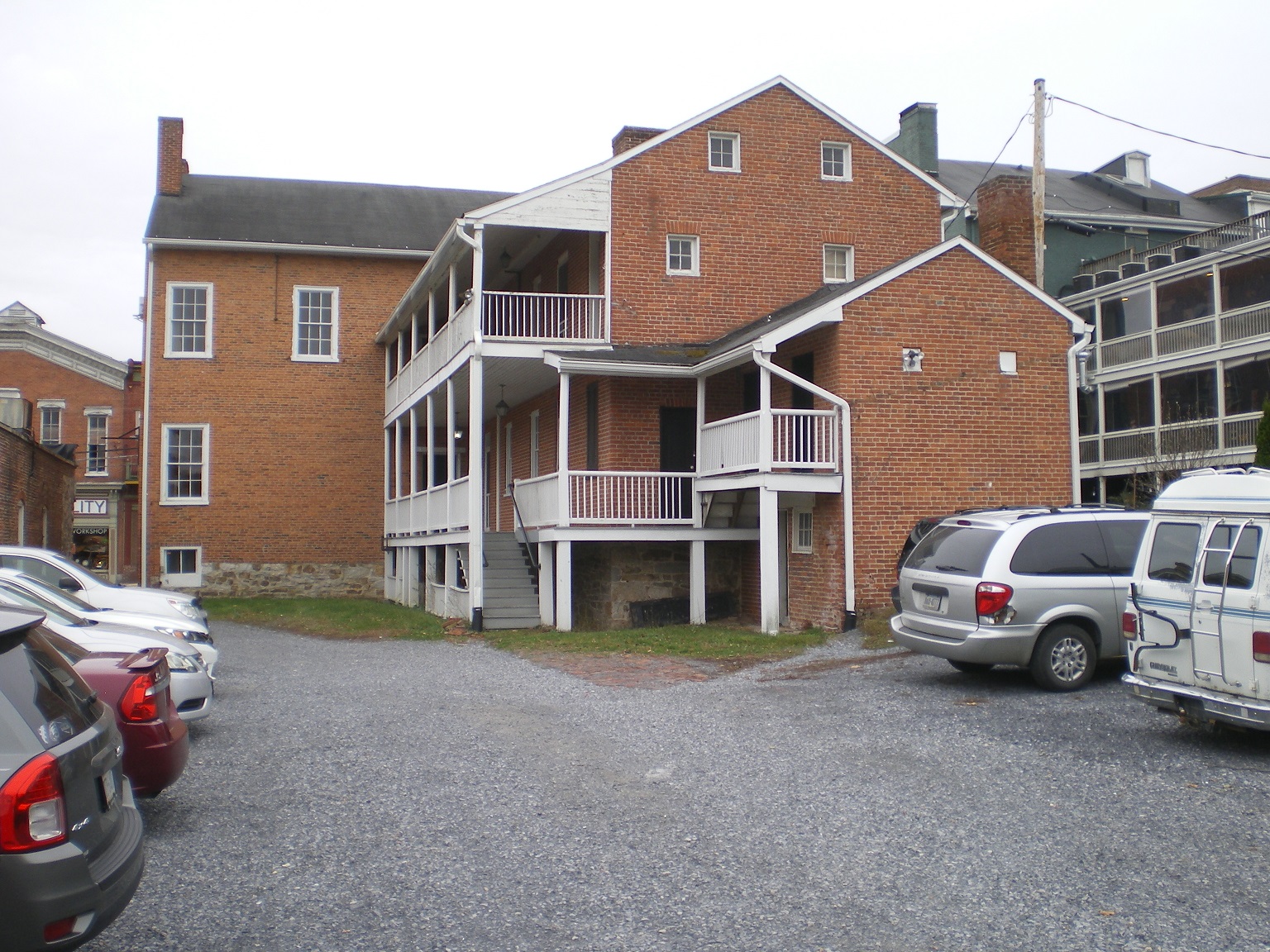 This photograph shows the multi-story rear porches on the Anderson House.