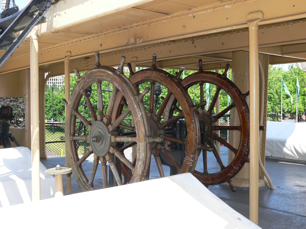 Large wheels below wood deck.