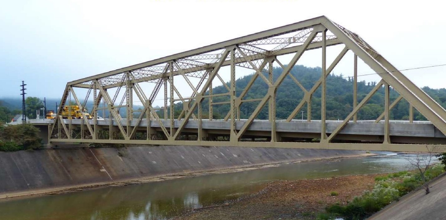 Metal truss bridge over water