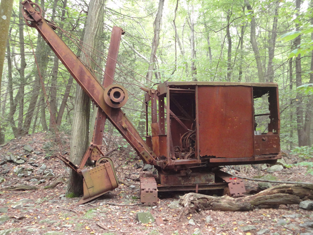 Rusted bulldozer in woods