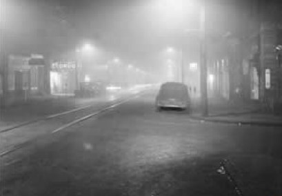 Streetlights in a dense fog