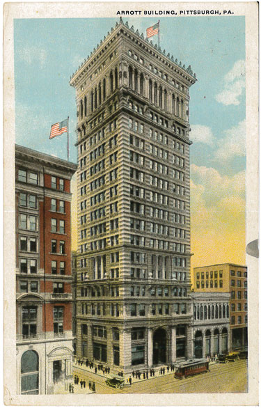 Color postcard of tall building.