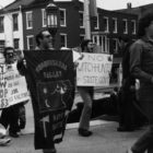 Men marching with signs