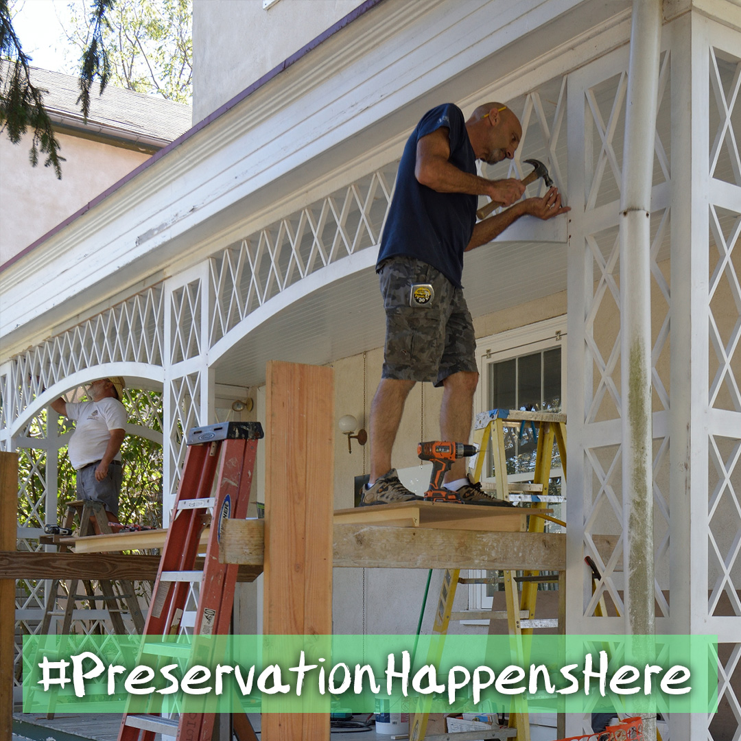 Man painting porch