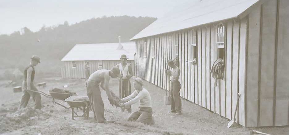 Historic photo of men working outside building.