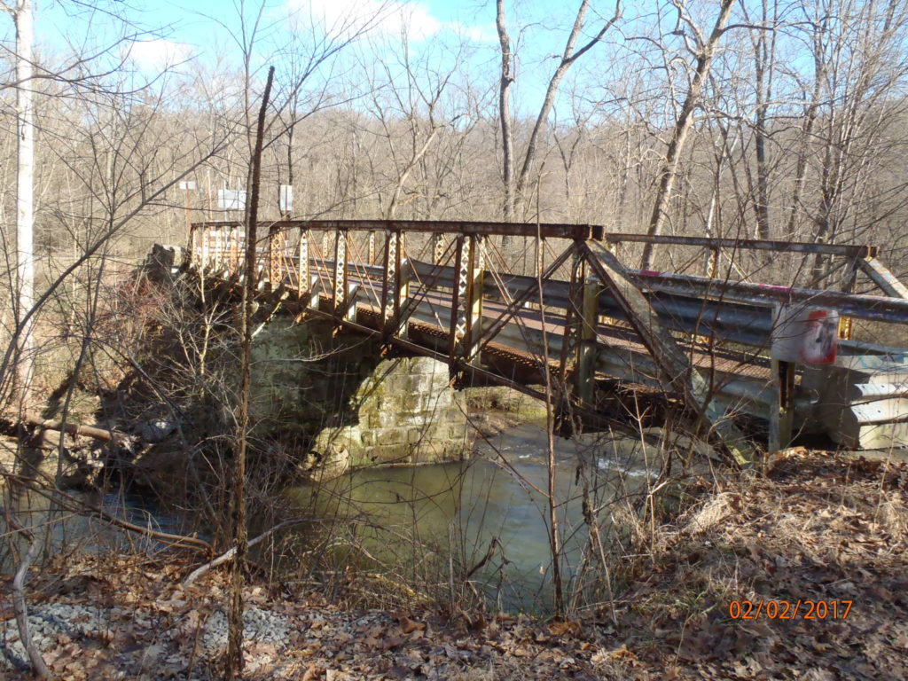 Metal truss bridge over water