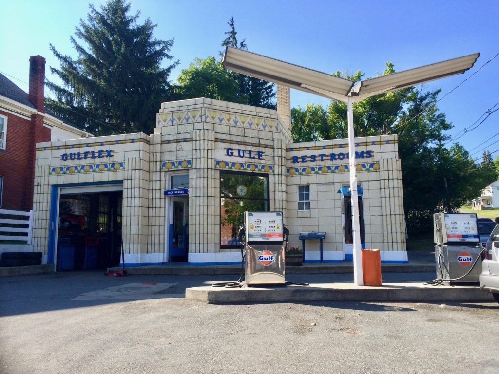 Colorful gas station with pumps.