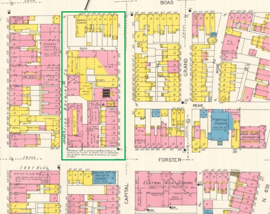 Map with buildings outlined and marked in red, yellow, and blue colors.