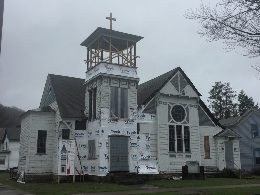Process of siding replacement and steeple reconstruction at small wood frame church.