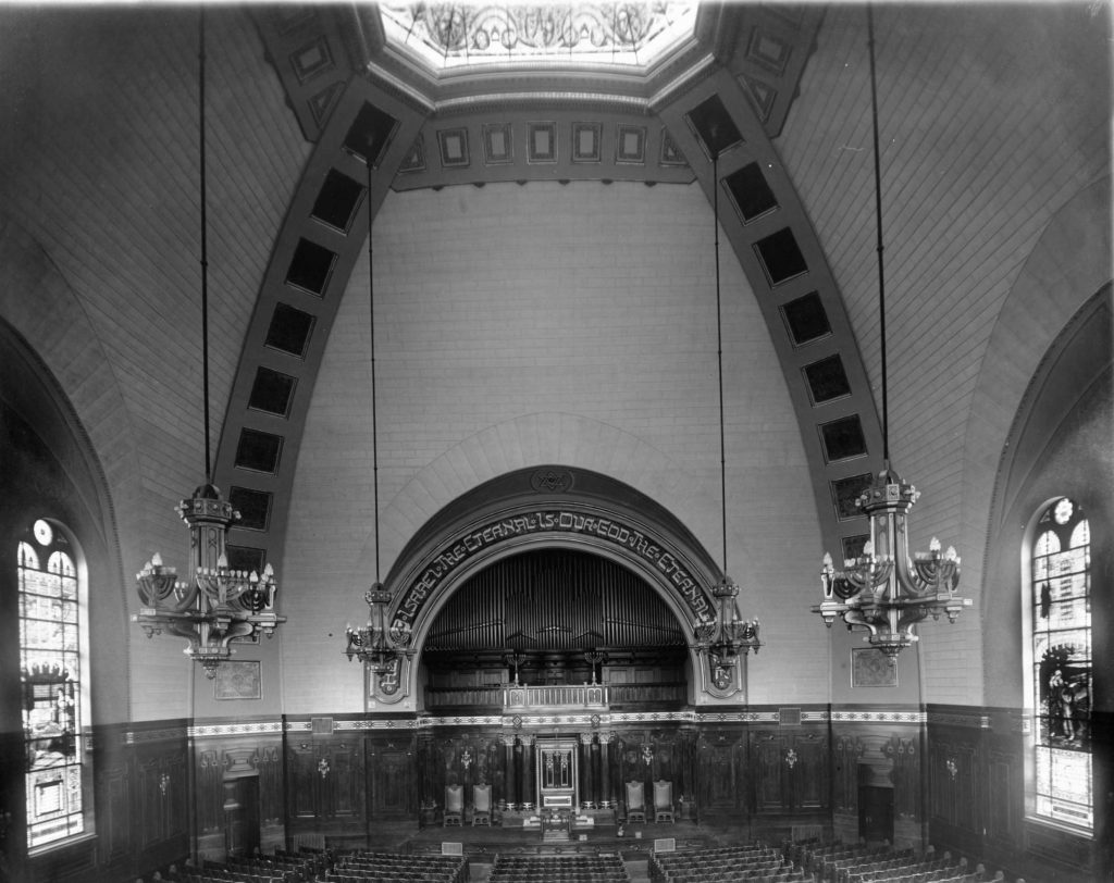 Historic photograph of the inside of Rodef Shalom showing large open space.