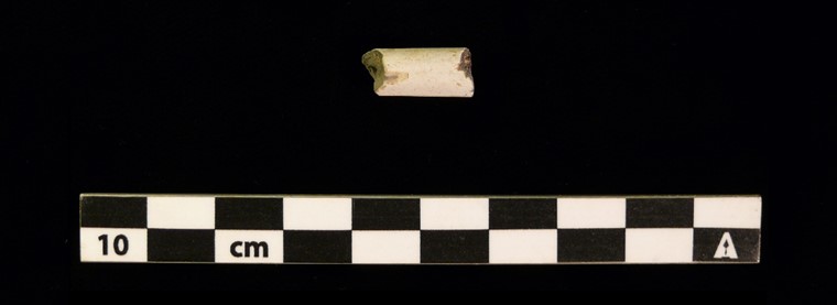 Small fragment of round white clay.