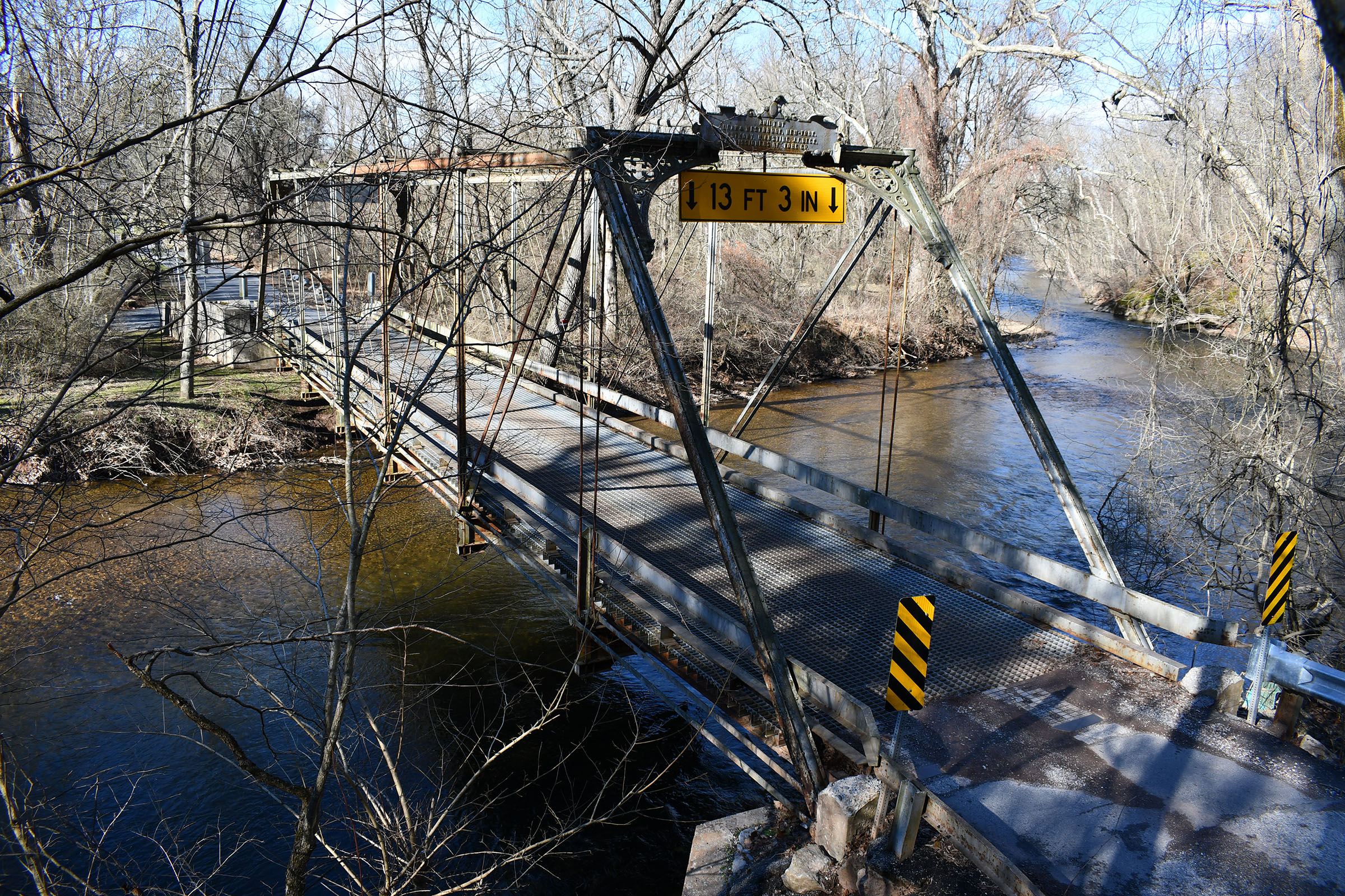Metal bridge over water.