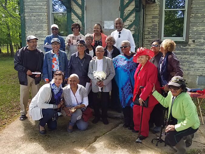 Group of people in front of a building.