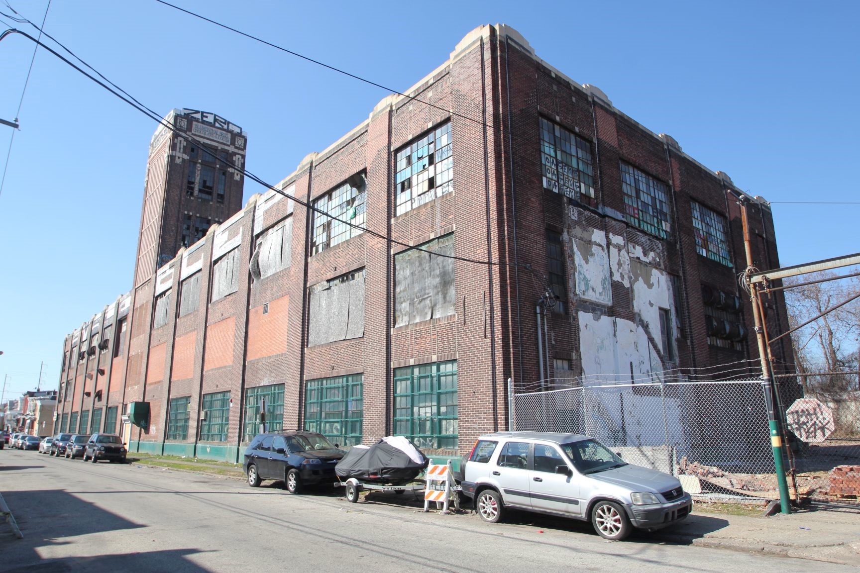 Three-story brick factory building.