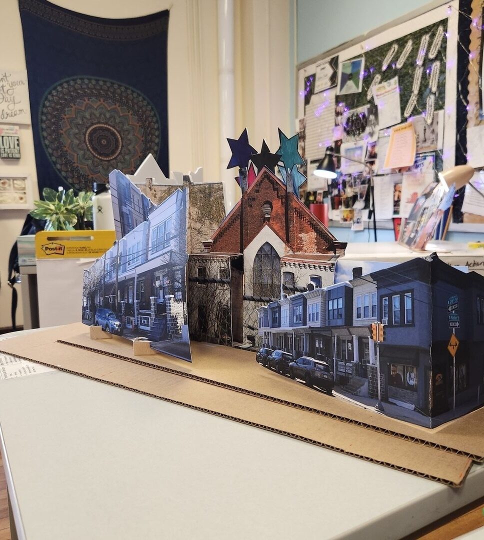 Paper and photo assembly of neighborhood buildings.