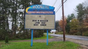 Tall letter sign for Moonlite Drive In Theater.