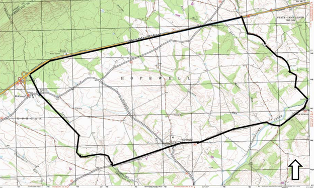 Colorful USGS map with a heavy black line denoting the boundaries of a large district.