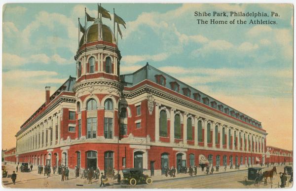 Color postcard of large three-story brick stadium.