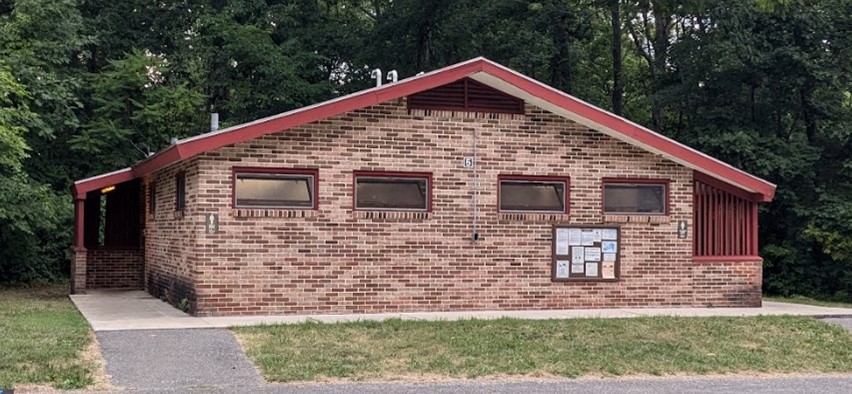 One-story brick building with gable roof and two entrances.