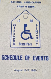 Blue and white paper with a diagram of a person in a wheelchair.