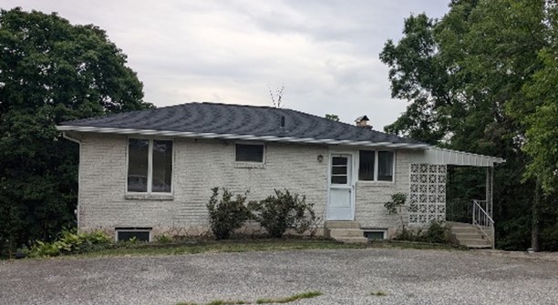 Small one-story brick house.