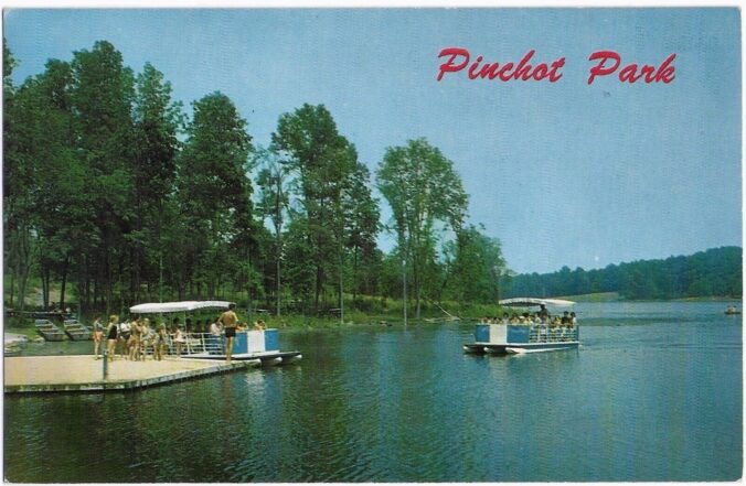 Groups of people floating on boats in water.