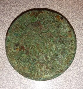 Round metal coin.