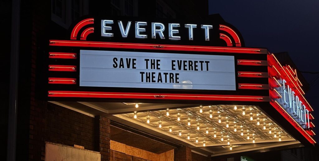 Marquee at night with the words "Save the Everett Theatre".