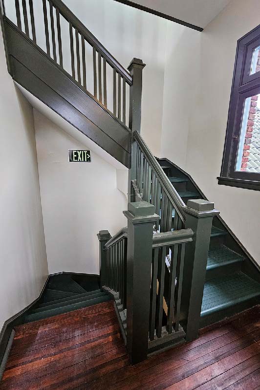 Wood staircase between floors.