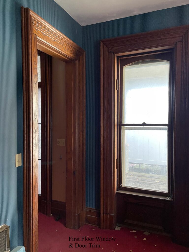 Window and door with wood trim.