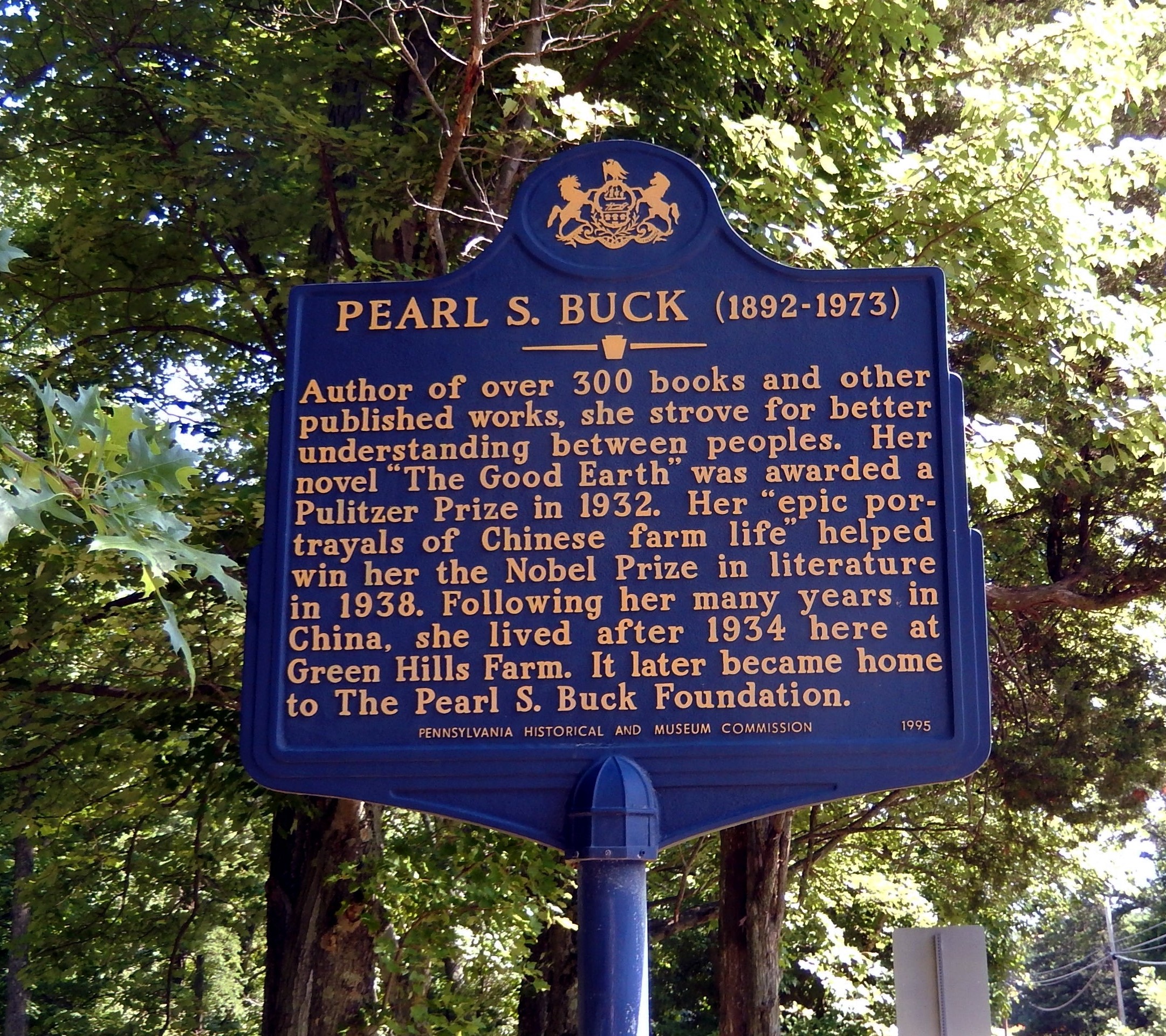 Blue sign with gold lettering for Pearl S. Buck (1892-1973).