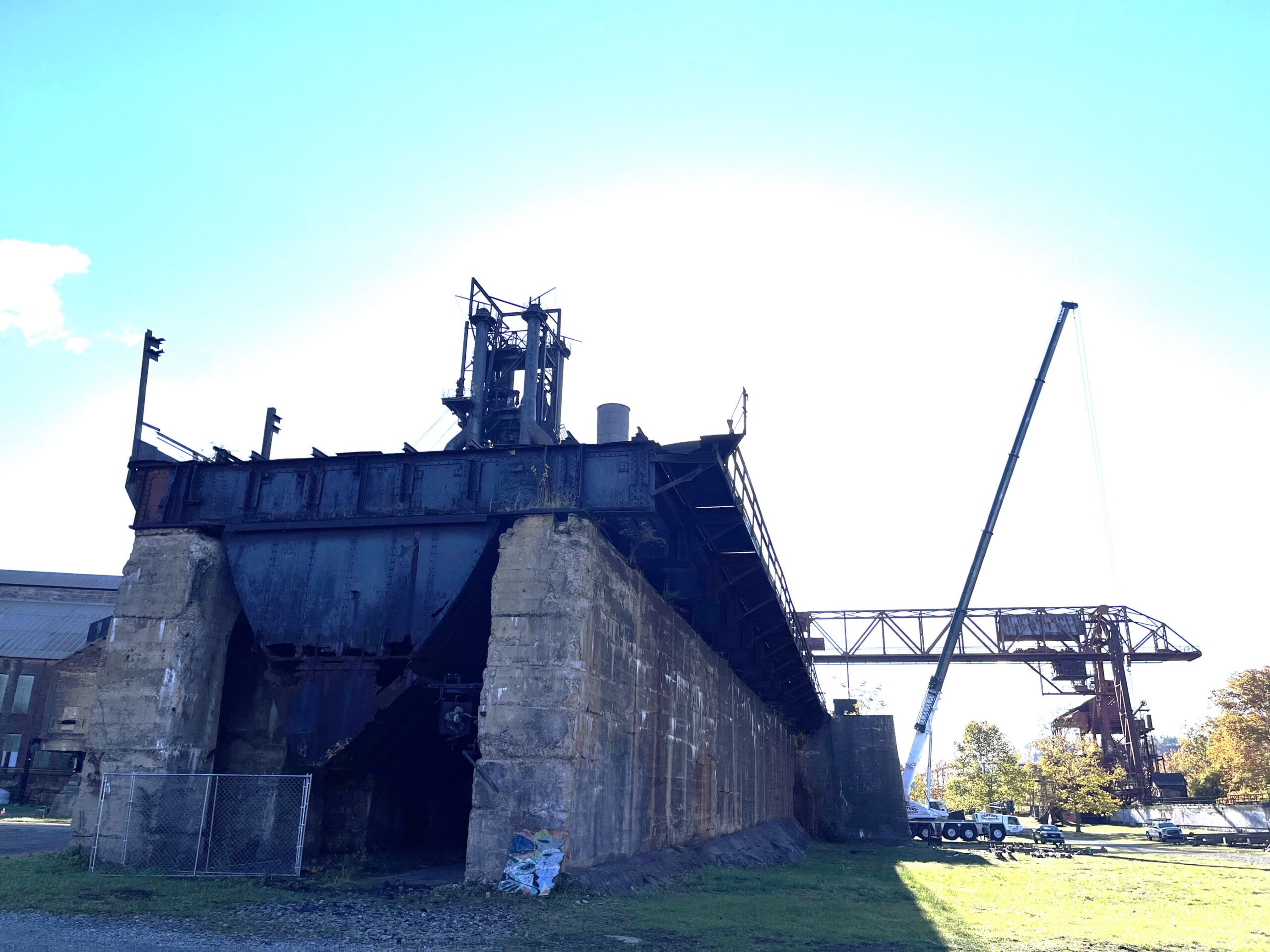 Two large masonry walls topped by a flat metal platform.