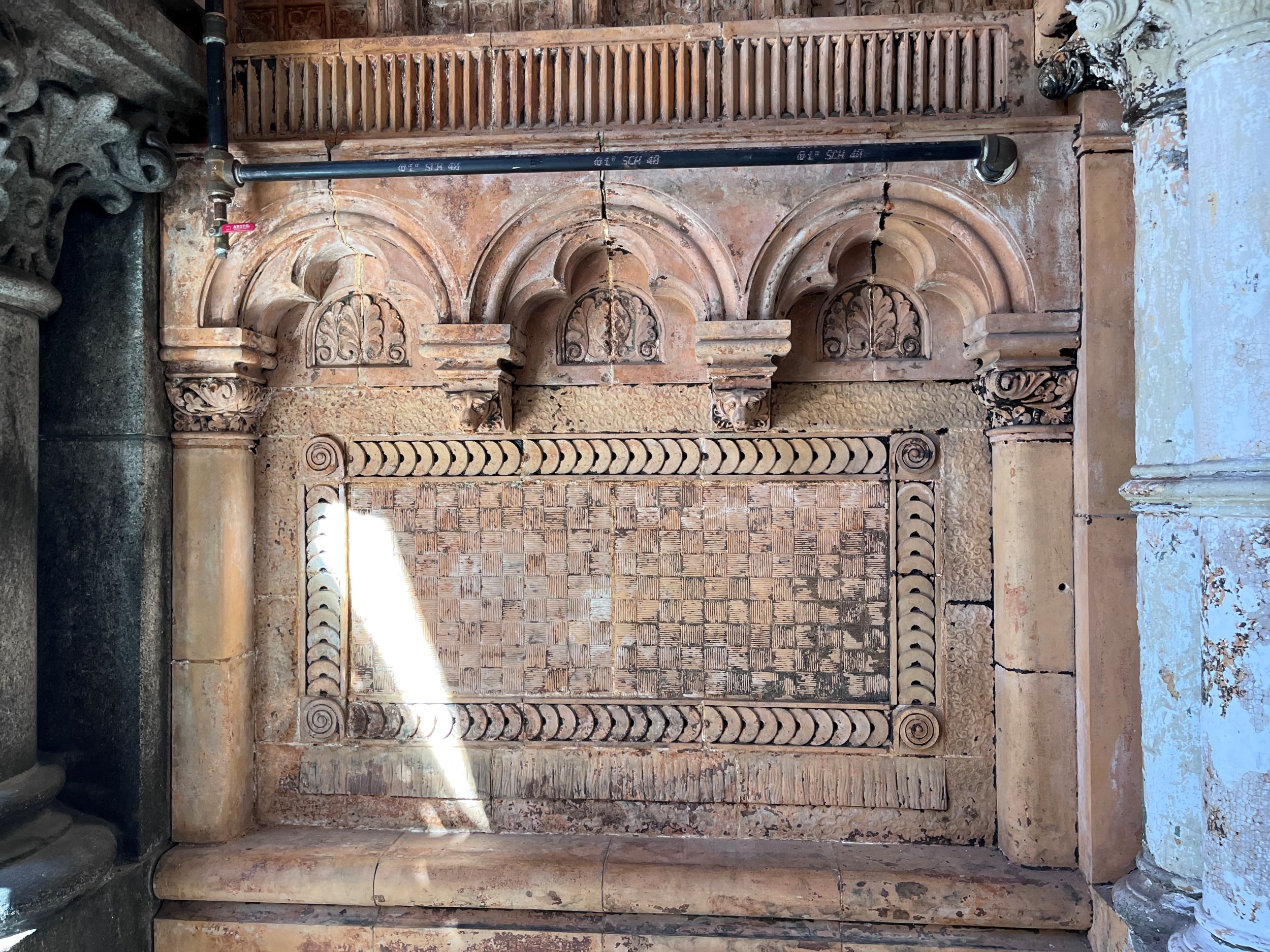 Decorative masonry panel with different textures and patterns.