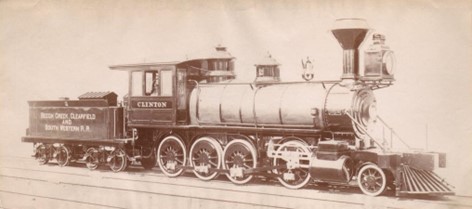 Train engine and car on a track.