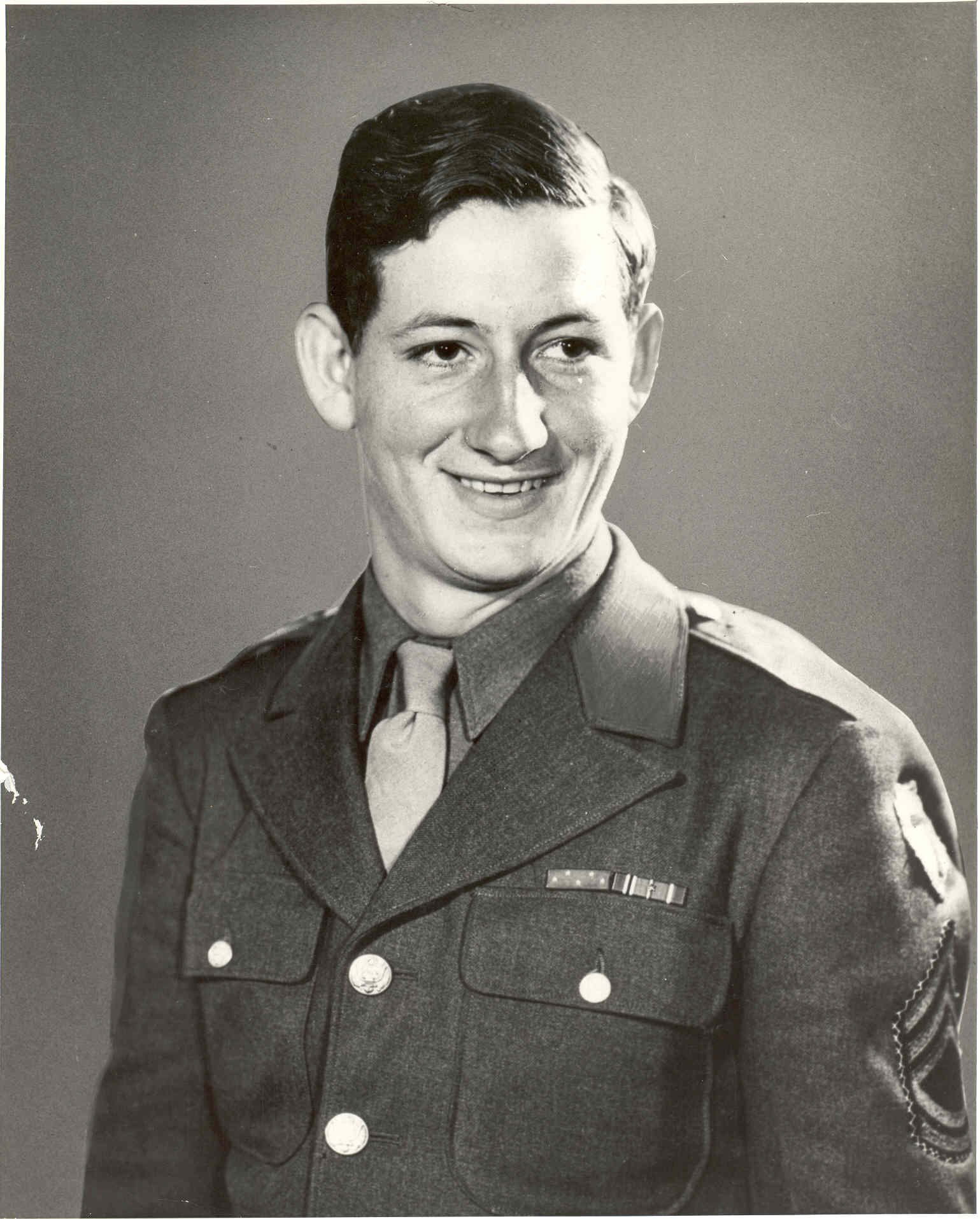 Portrait of a man in a military uniform.